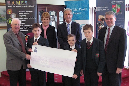 Pictured at the presentation are Samaritans Paddy Mallon and Eileen Winters receiving a cheque from pupils of the school, accompanied by the Principal Mr. Hugh Mallon and Mr. Pat McParland, year head teacher.